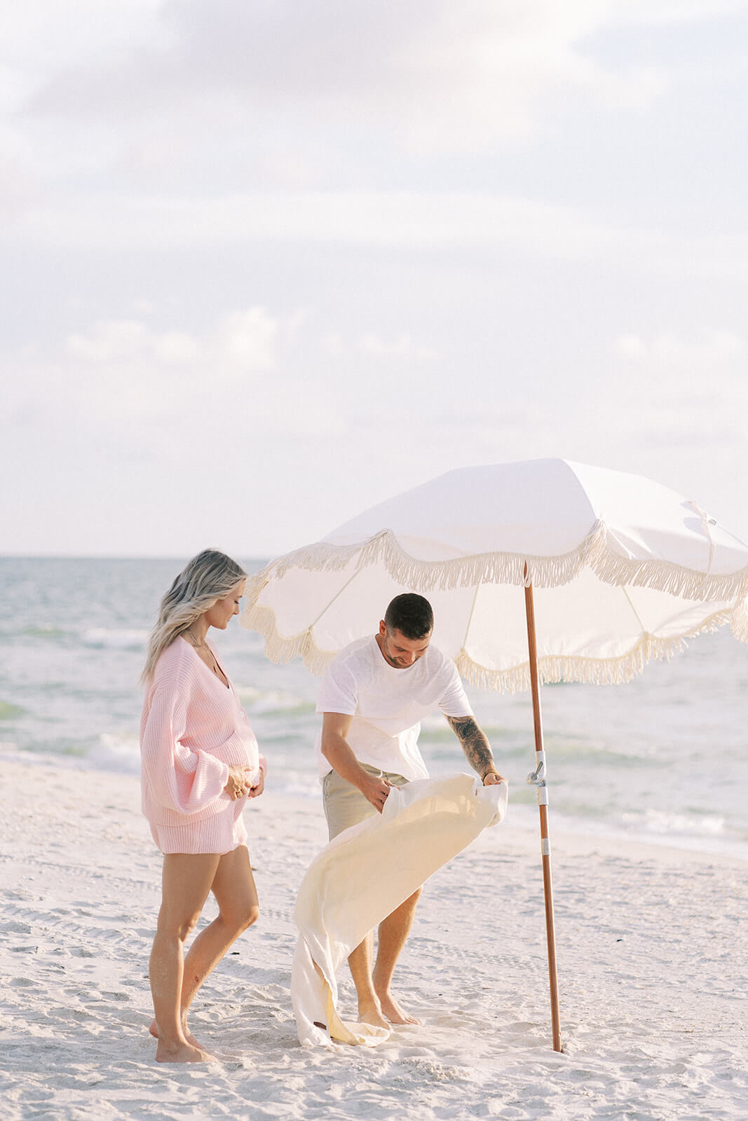 pregnant couple on the beach in Naples Florida