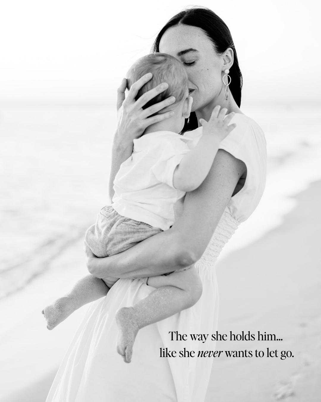 mom holding her baby on a naples beach